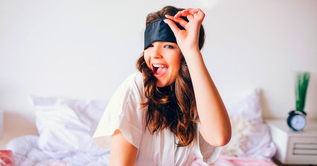 Woman waking up in her new bed.