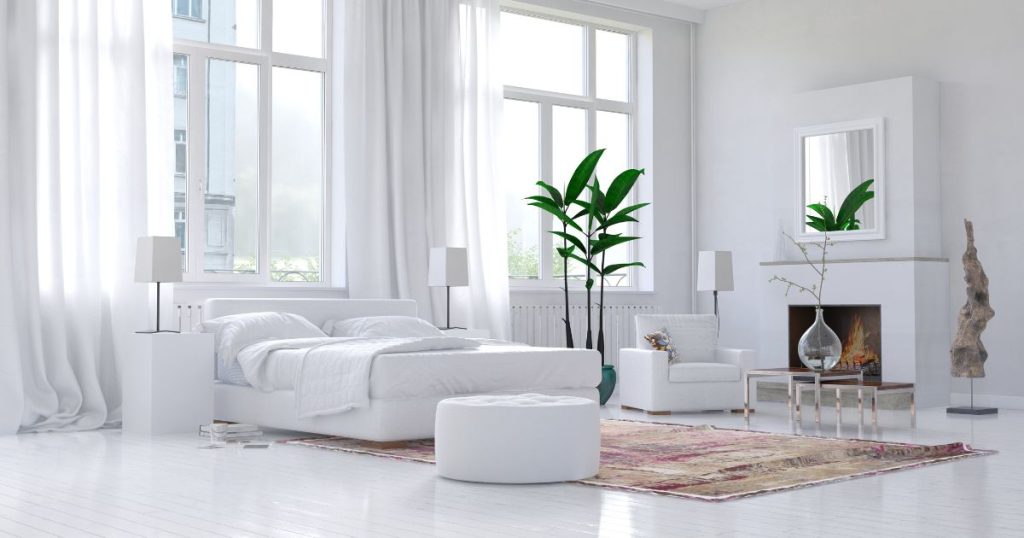 White bedroom with organic latex mattress and minimal decor