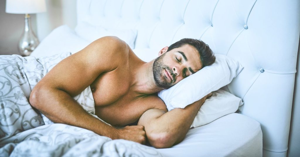 Man sleeping on an organic latex and pure wool mattress - the best natural sleep remedy.