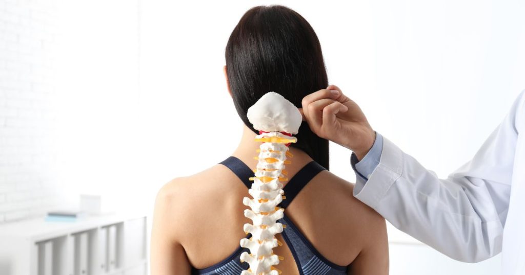 Woman with curve in her spine caused by bad mattress